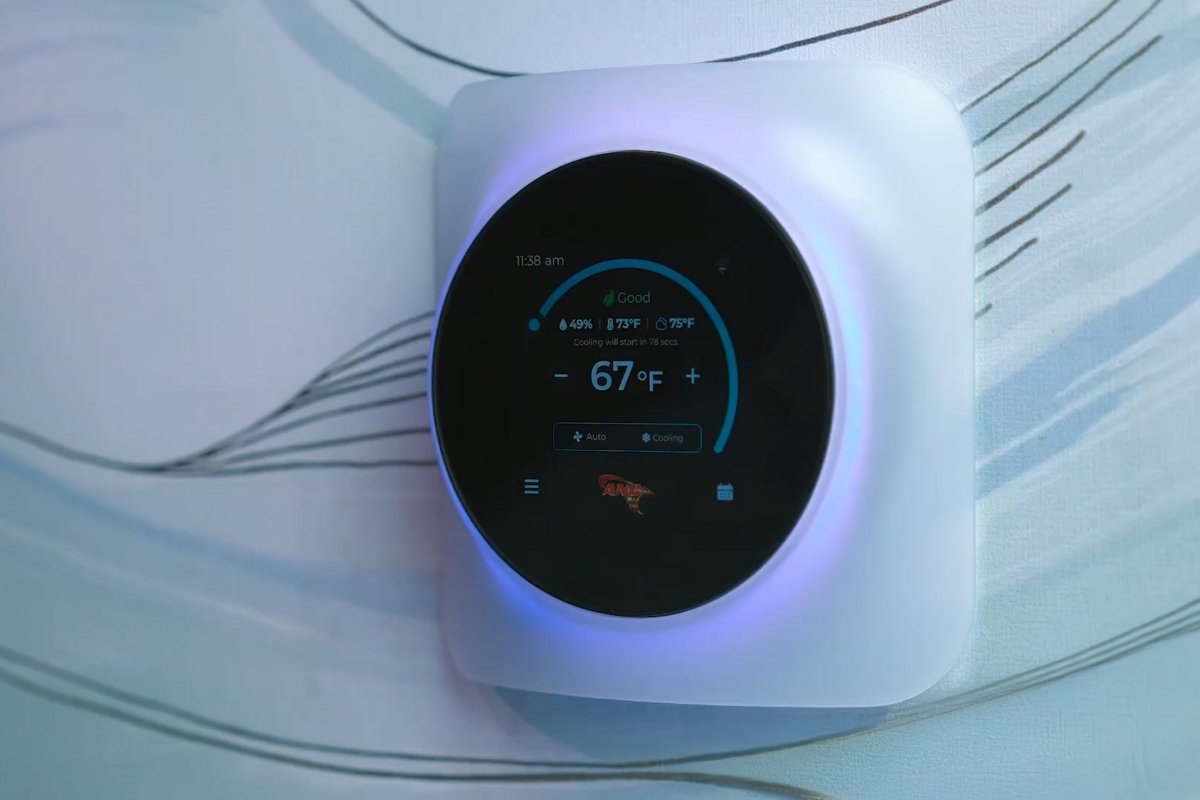 Close-up of the ANC Nova Wi-Fi thermostat mounted on a hallway wall in a Binghamton NY home displaying indoor temperature and humidity readings