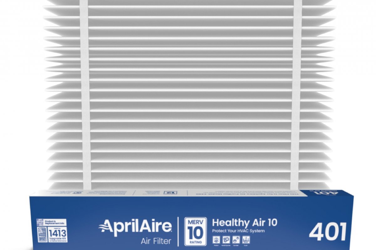Aprilaire whole-home air filtration system installed in a Binghamton NY home HVAC system beside a furnace showing a high-MERV filter housing for superior indoor air quality