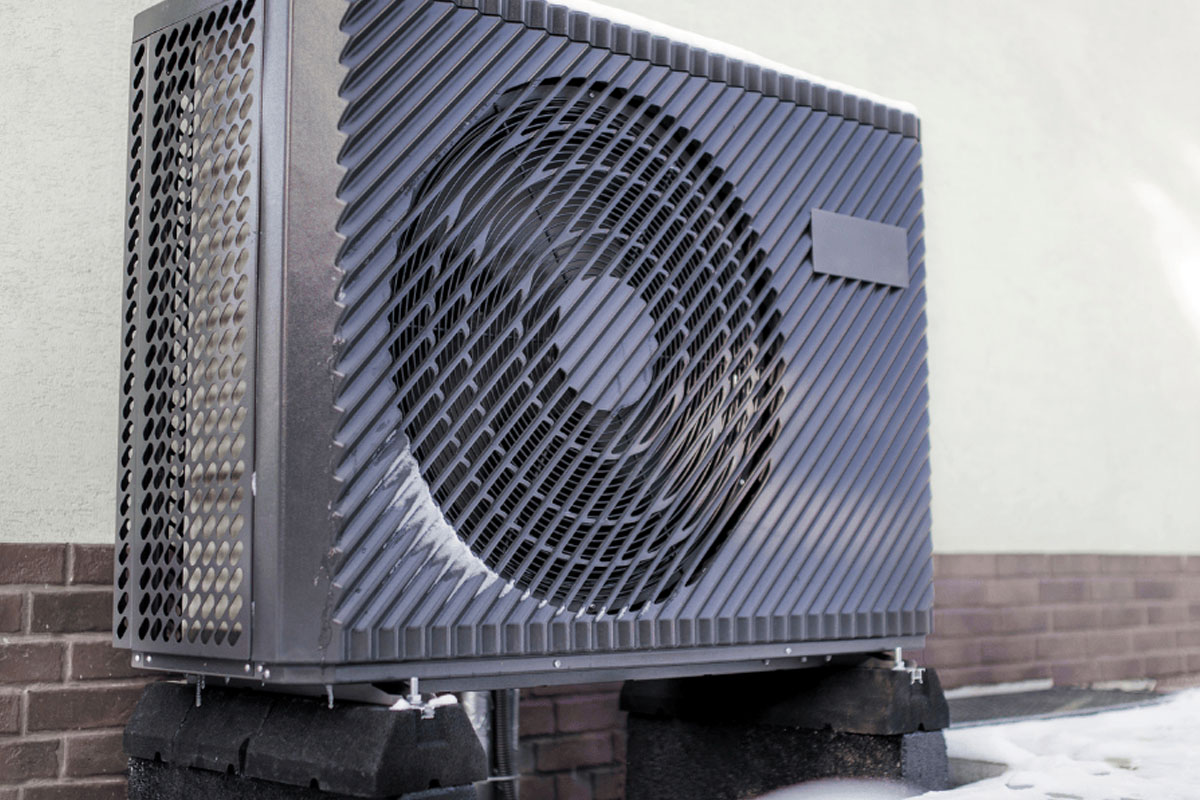 Heat pump unit covered in snow