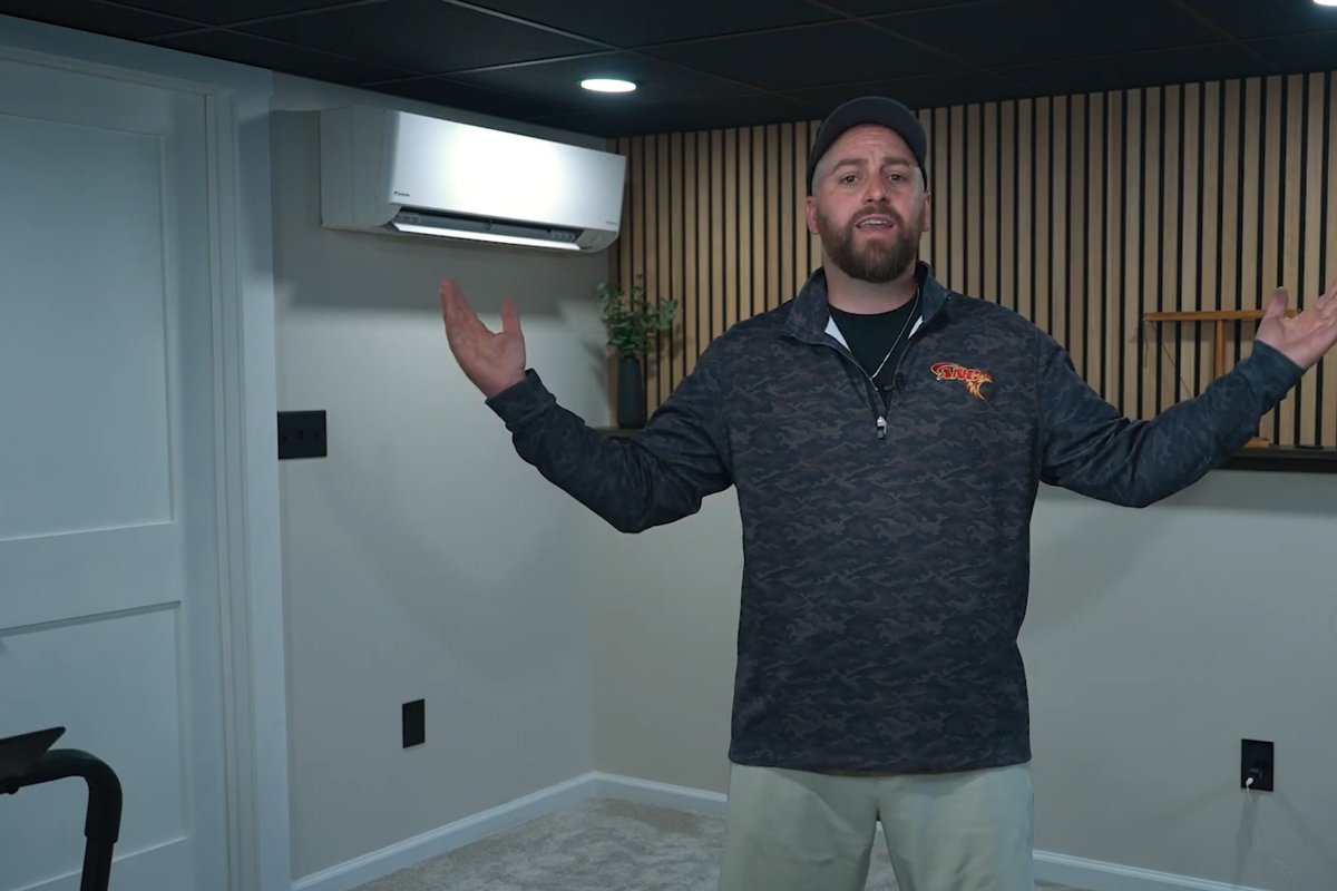 Wall-mounted ductless mini split unit installed in a newly finished basement family room in a Greater Binghamton NY home
