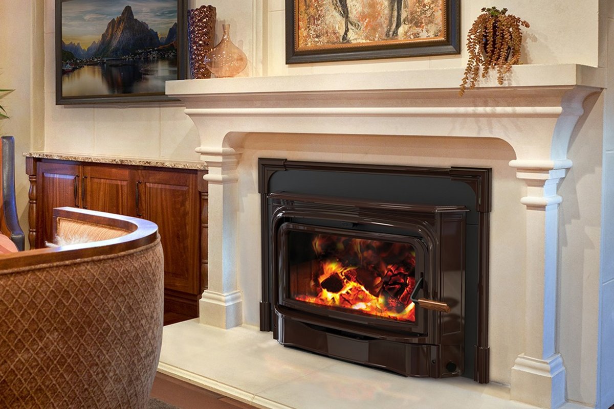 Homeowner browsing fireplace inserts in ANC's Endicott NY hearth showroom before winter