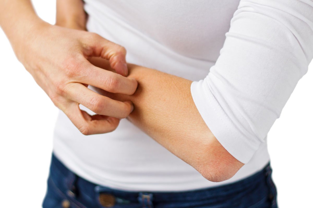 A comfortable living room in a Binghamton NY home during winter with warm lighting illustrating the benefits of whole-home humidification